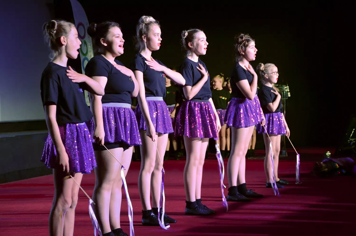 Dance school students performing on stage at Disneyland Paris