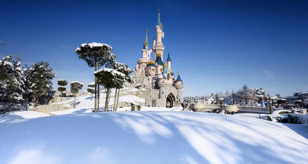Enchanted Christmas snow covered Sleeping Beauty Castle