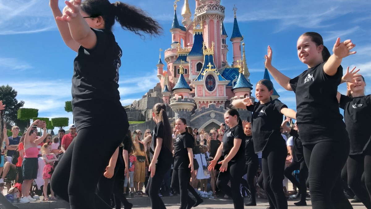 Time to Shine parade in front of Sleeping Beautys Castle